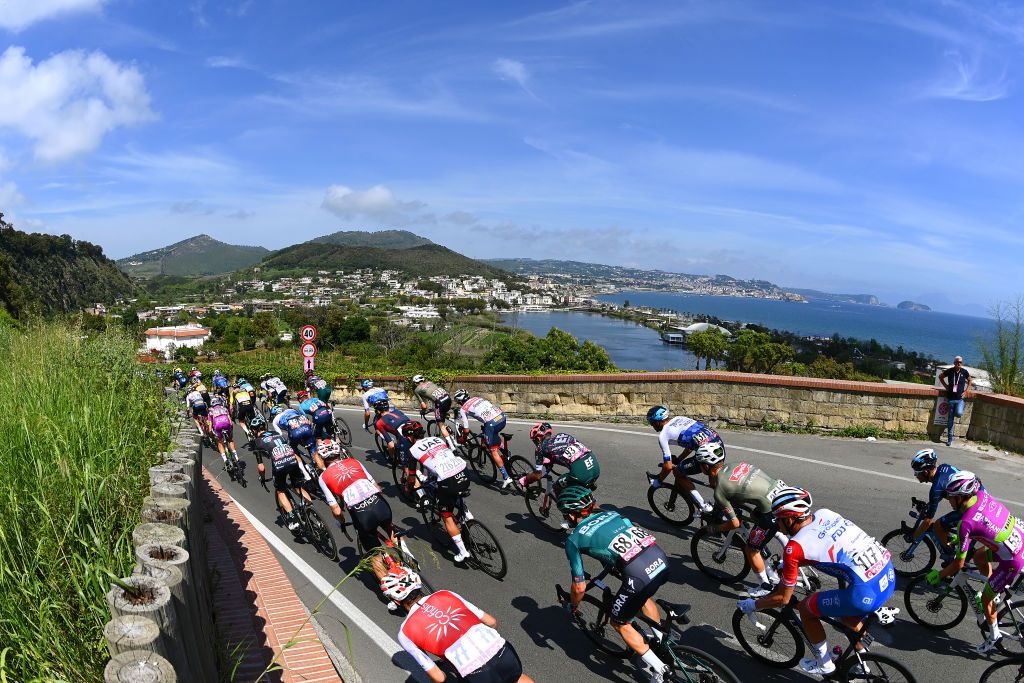 NAPOLI ITALY MAY 14 Ben Zwiehoff of Germany and Team Bora Hansgrohe Ramon Sinkeldam of Netherlands and Team Groupama FDJ and a general view of the peloton competing next to the Napoli seaside during the 105th Giro dItalia 2022 Stage 8 a 153km stage from Napoli to Napoli Giro WorldTour on May 14 2022 in Napoli Italy Photo by Tim de WaeleGetty Images