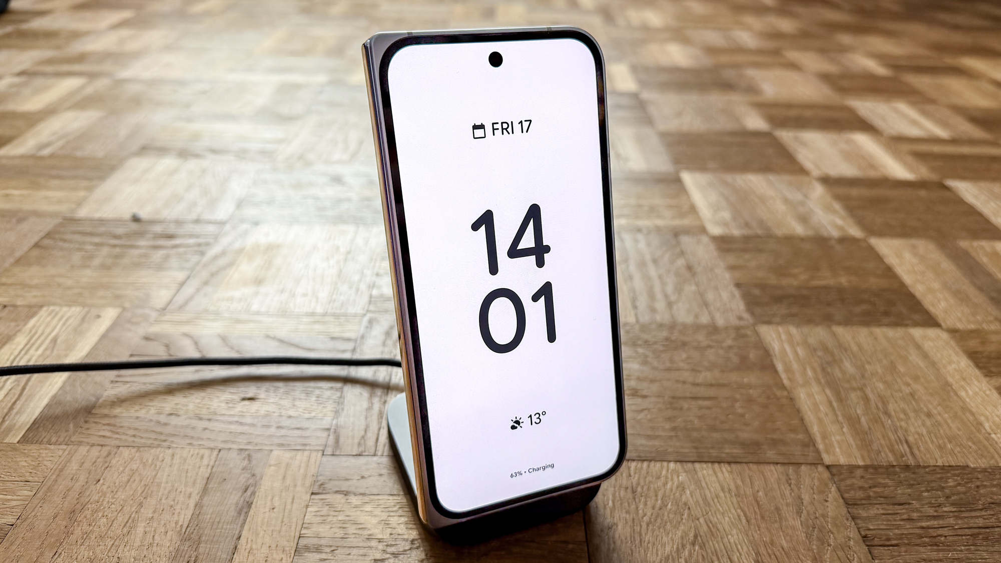 Google Pixel 10 Pro Fold on a Magsafe charging stand in its standby mode