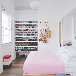 White bedroom with built in shoe storage