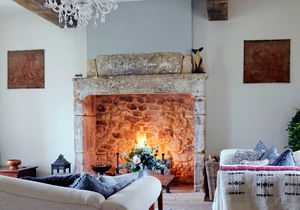 living room with white wall and fire place