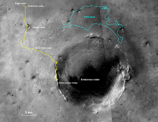 Outlined in yellow is Opportunity’s journey from Eagle Crater towards its final resting spot on the rim of Endeavour Crater. The blue outline of Victoria’s Phillip Island is included for scale.