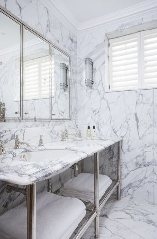 luxurious marble bathroom with large mirrors