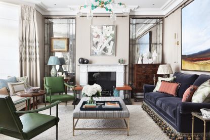 living room with coffee table styling by K&H Design with colorful glass pendant and chinoiserie lamp