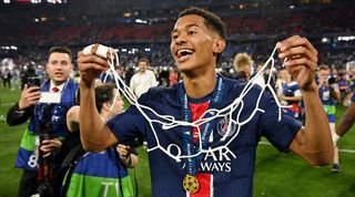 Senny Mayulu celebrates with a piece of the net after Paris Saint-Germain's 5-0 win over Inter in the Champions League final in May 2025.