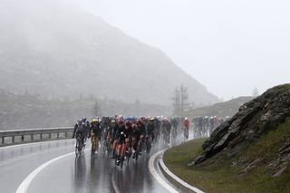CASSANO MAGNAGO ITALY MAY 20 A general view of Salvatore Puccio of Italy and Team INEOS Grenadiers and the peloton compete in the peloton passing through Simplon Pass 2004m during the 106th Giro dItalia 2023 Stage 14 a 194km stage from Sierre to Cassano Magnago UCIWT on May 20 2023 in Cassano Magnago Italy Photo by Tim de WaeleGetty Images