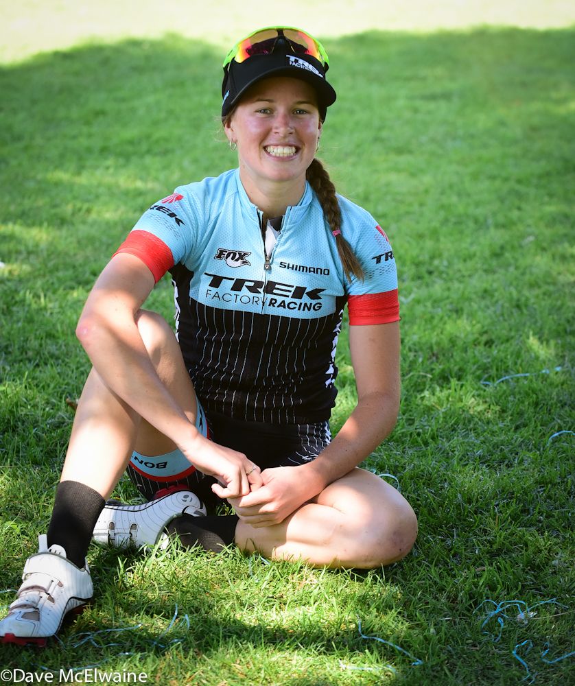Bec Henderson watches as her husband Dan McConnell rides to victory.