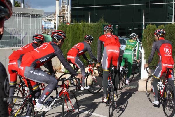 After you. The RadioShack riders exit the hotel car park.