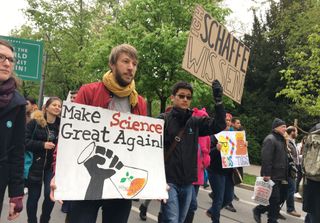 People march in support of scientific research during the March for Science demonstration on April 22, 2017 in Munich, Germany.