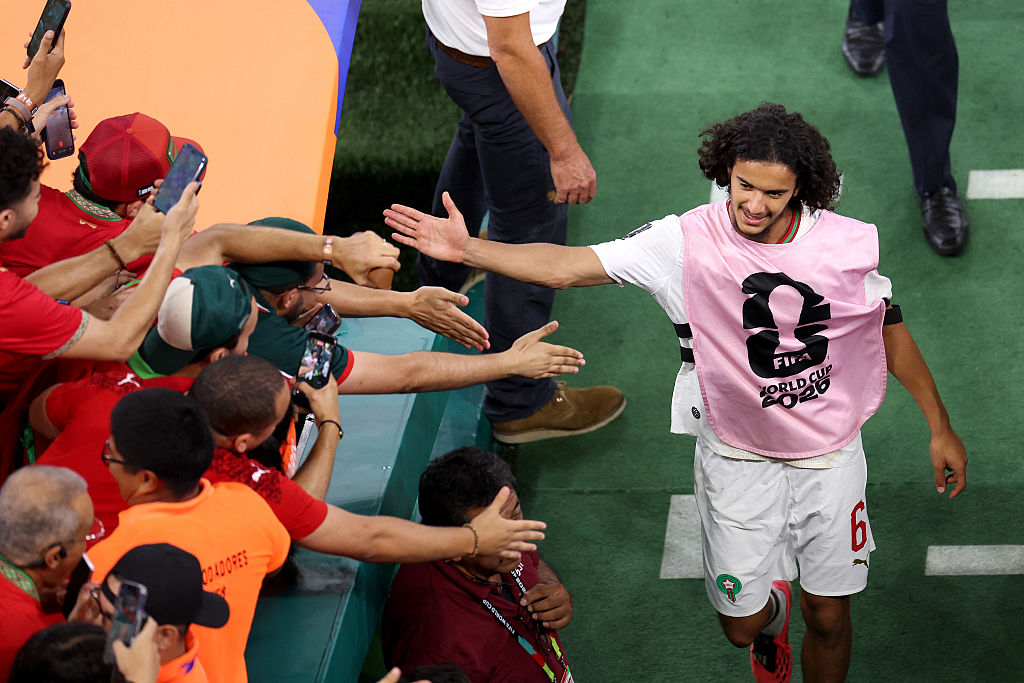 Ayyoub Bouaddi high-fives Morocco fans at the World Cup