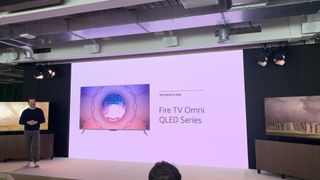 amazon Fire TV Omni Series displayed on a big screen, as part of a press conference