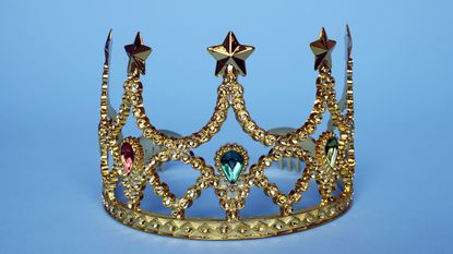 Gold tiara with blue background