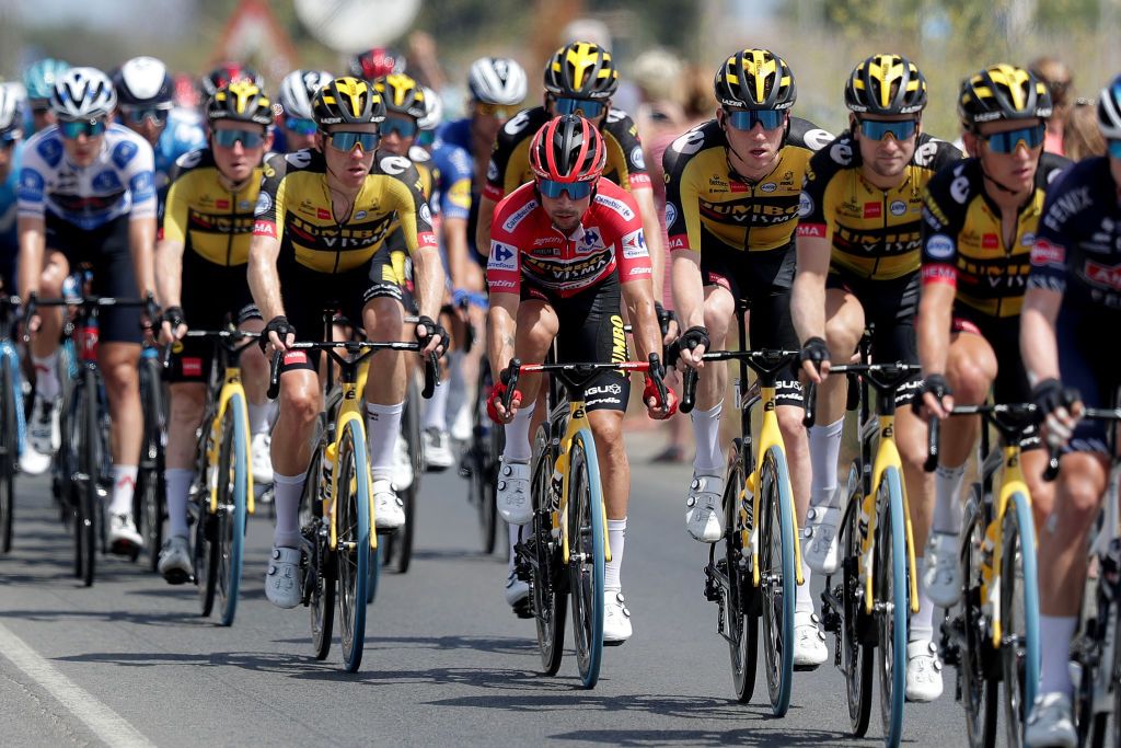 LA MANGA SPAIN AUGUST 21 Primoz Roglic of Slovenia red leader jersey and Nathan Van Hooydonck of Belgium and Team Jumbo Visma compete during the 76th Tour of Spain 2021 Stage 8 a 1737 km stage from Santa Pola to La Manga del Mar Menor lavuelta LaVuelta21 on August 21 2021 in La Manga Spain Photo by Gonzalo Arroyo MorenoGetty Images