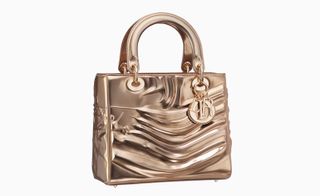 Jason Martin's Dior bags was made from a copper-toned sculpted calfskin, with tone on tone jewellery