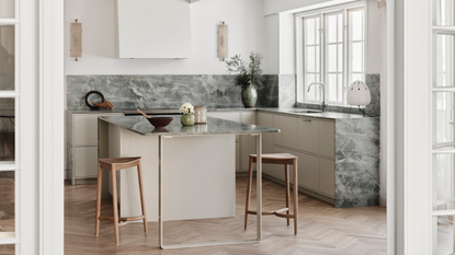bright scandi kitchen with white cabinets and greeny blue marble counters