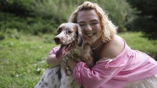 Lady in pink hugging her setter