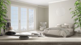A stylish feng shui bedroom with plenty of light and a calming, neutral design