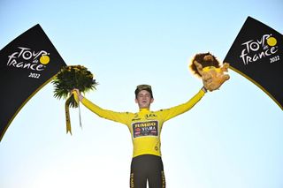 JumboVisma teams Danish rider Jonas Vingegaard celebrates on the podium with the overall leaders yellow jersey after winning the 109th edition of the Tour de France cycling race after the 21st and final 1156 km stage between La Defense Arena in Nanterre outside Paris and the ChampsElysees in Paris France on July 24 2022 Photo by Marco BERTORELLO AFP Photo by MARCO BERTORELLOAFP via Getty Images