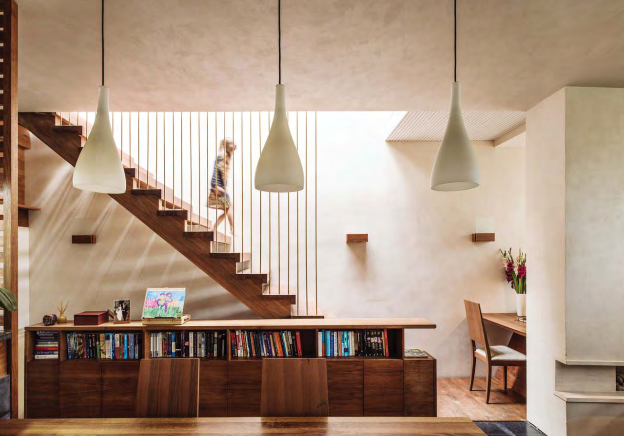 The two downstairs rooms are lit by the landscaped sunken courtyards