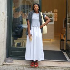 Nnenna Chem wears a suede midi skirt