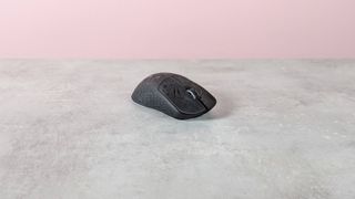 Three-quarter view of Keychron G5 on a desk with pink wall in background