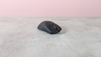 Three-quarter view of Keychron G5 on a desk with pink wall in background
