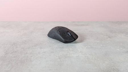 Three-quarter view of Keychron G5 on a desk with pink wall in background