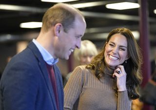 Britain's Prince William, Duke of Cambridge (L) and Britain's Catherine, Duchess of Cambridge, visit Church on the Street in Burnley, northern England on January 20, 2022