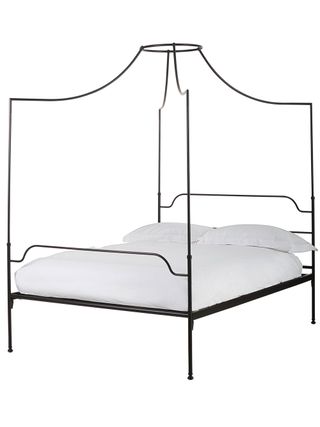 Black metal bed with dainty frame with white mattress and 2 white pillows
