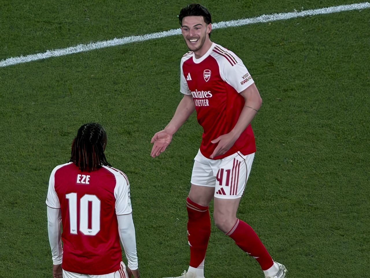 A Champions League soccer match between Arsenal and Atletico Madrid, as seen from the upper stand at the Emirates stadium, London. Zoomed in photos of the players
