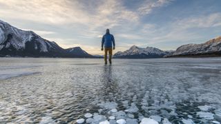 A man standing on a frozen lake