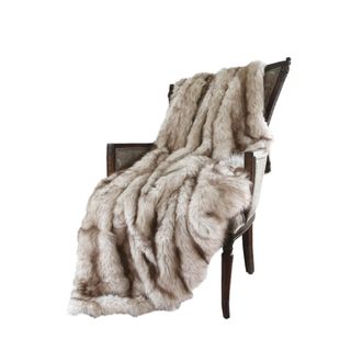 A gray furry throw on a chair