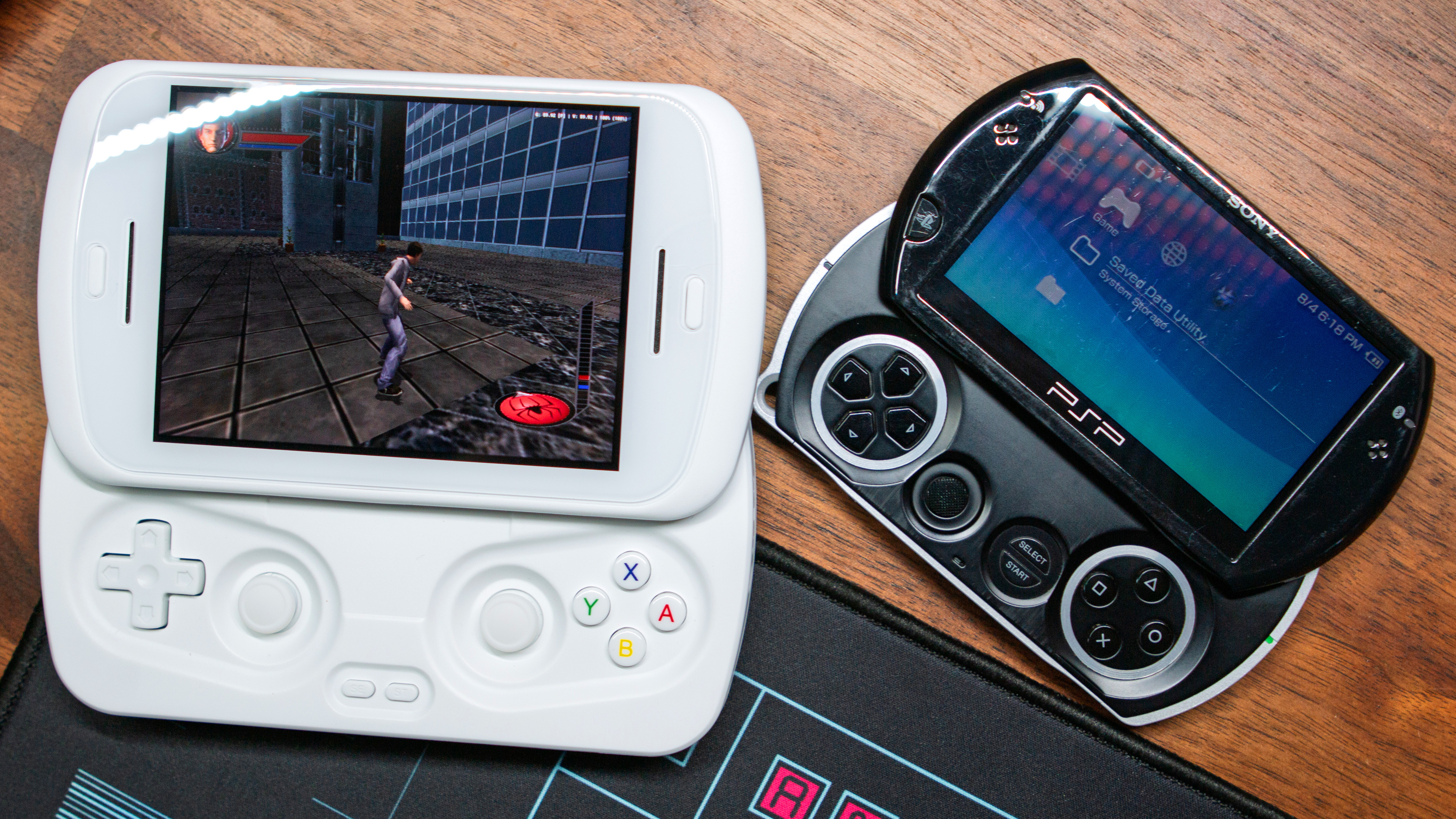 Anbernic RG Slide next to PSP Go