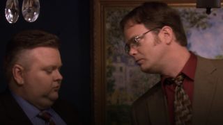 Dwight talking to a guy in The Office