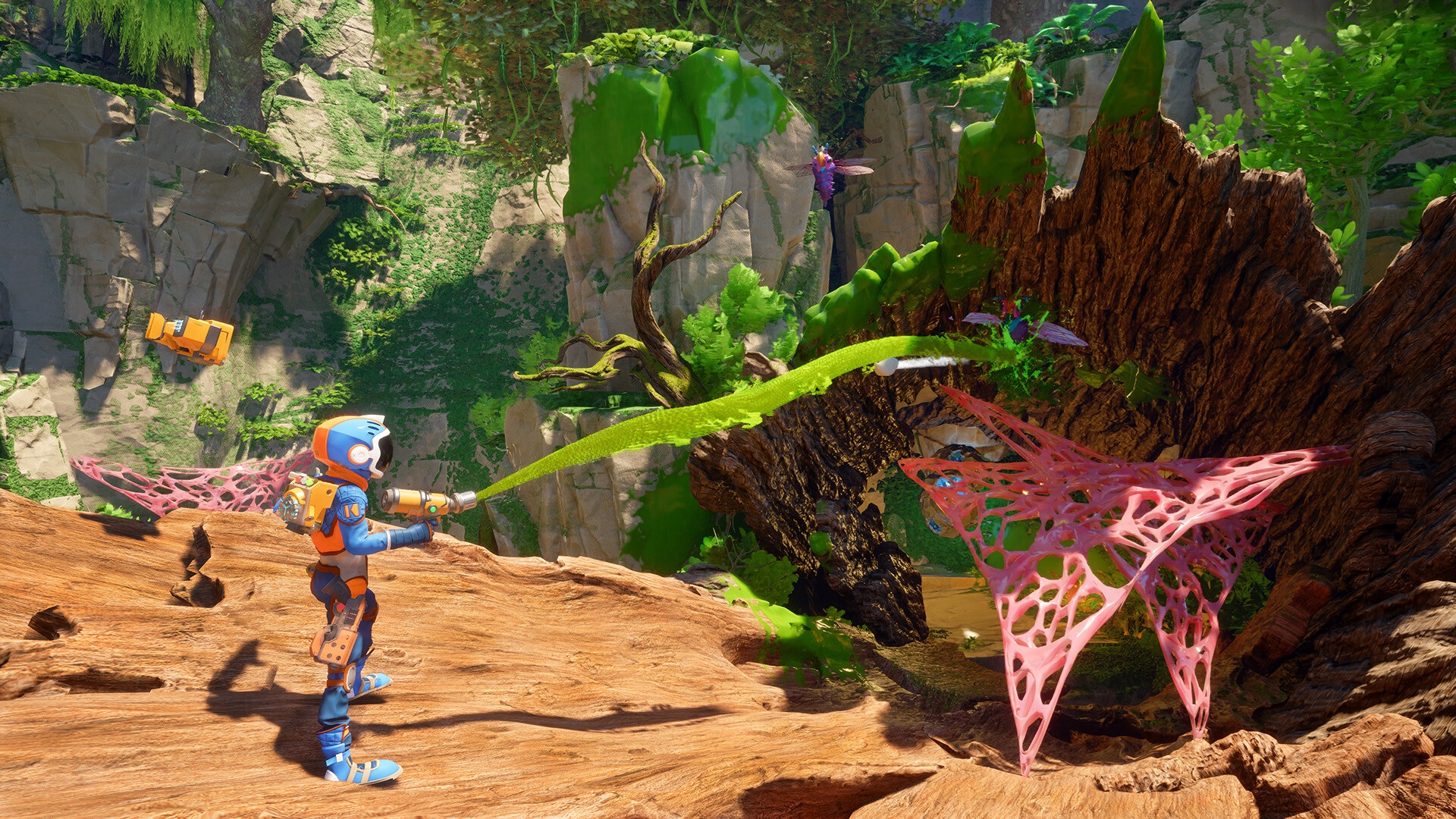 A character shooting goo out of a gun in Revenge of the Savage Planet