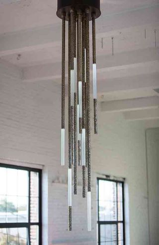Light consisting of carved rods with illuminated sections at different levels