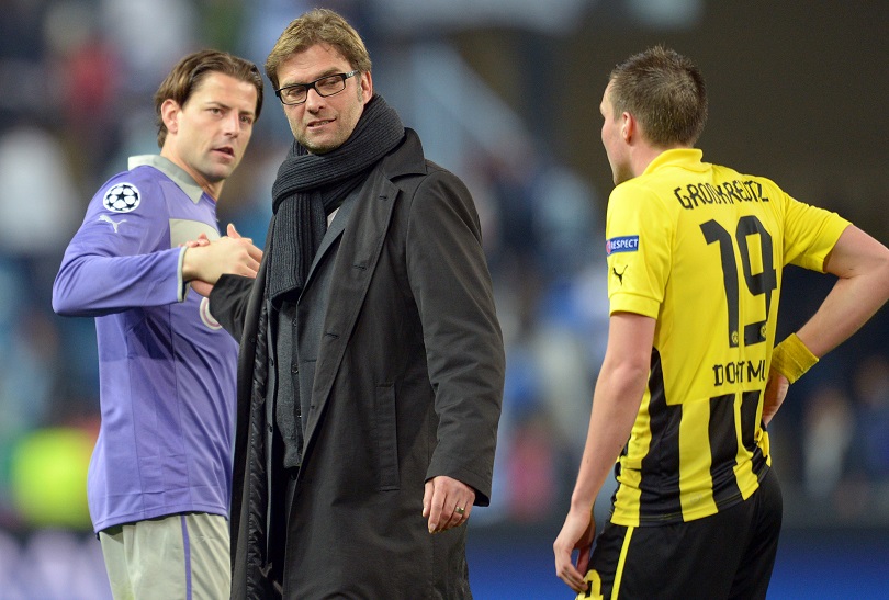 Kevin Grosskreutz approaches Jurgen Klopp during their time at Dortmund