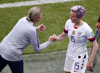 United States coach Jill Ellis shakes hands with Megan Rapinoe