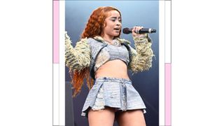 Ice Spice wears a denim mini skirt and matching top at the Governors Ball Music Festival 2023