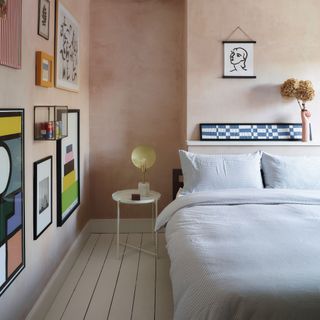 Limewashed pink bedroom with gallery wall display