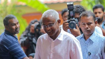 Opposition Maldives candidate Ibrahim Mohamed Solih arrives at a polling station to vote