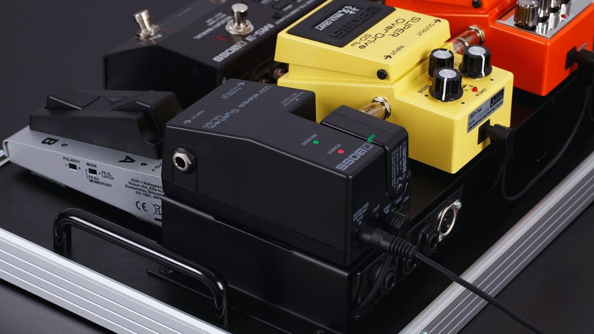 A Boss WL-50 wireless guitar system on a pedalboard