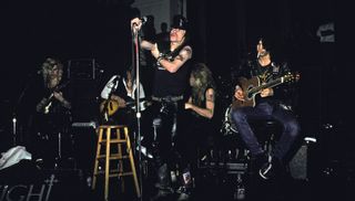 (from left) Duff McKagan, Izzy Stradlin, Axl Rose, Steven Adler and Slash of Guns N' Roses perform an acoustic set at The Limelight on January 31, 1988 in New York City