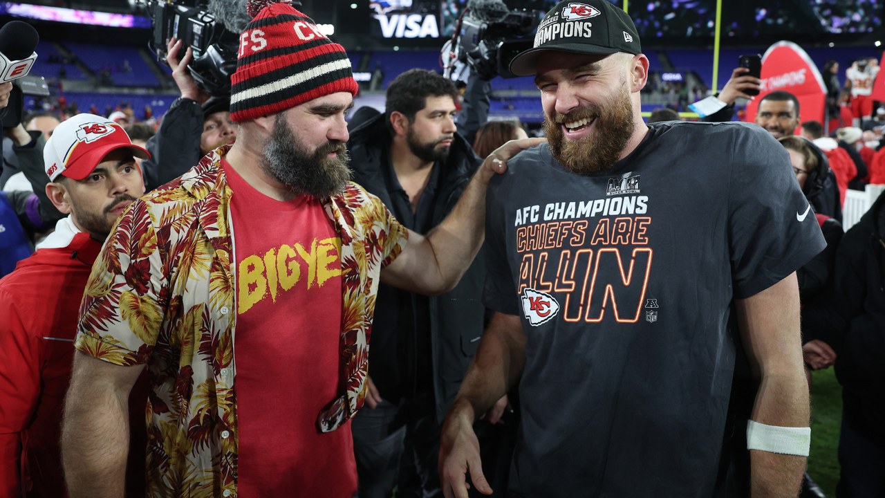 Travis Kelce #87 of the Kansas City Chiefs celebrates with his brother Jason Kelce after a 17-10 victory against the Baltimore Ravens in the AFC Championship Game at M&amp;T Bank Stadium on January 28, 2024 in Baltimore, Maryland. 