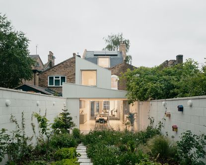 garden at white patio house by pashenko works