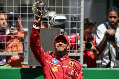 Ferrari's British driver Lewis Hamilton wins the sprint race of the Formula One Chinese Grand Prix