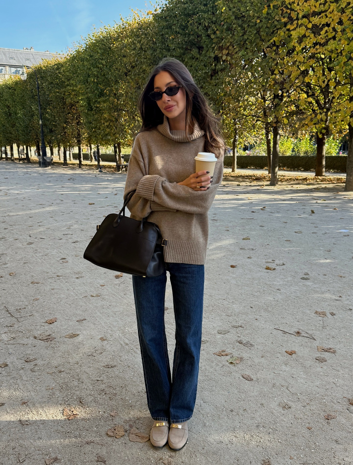 Woman in turtleneck and jeans.