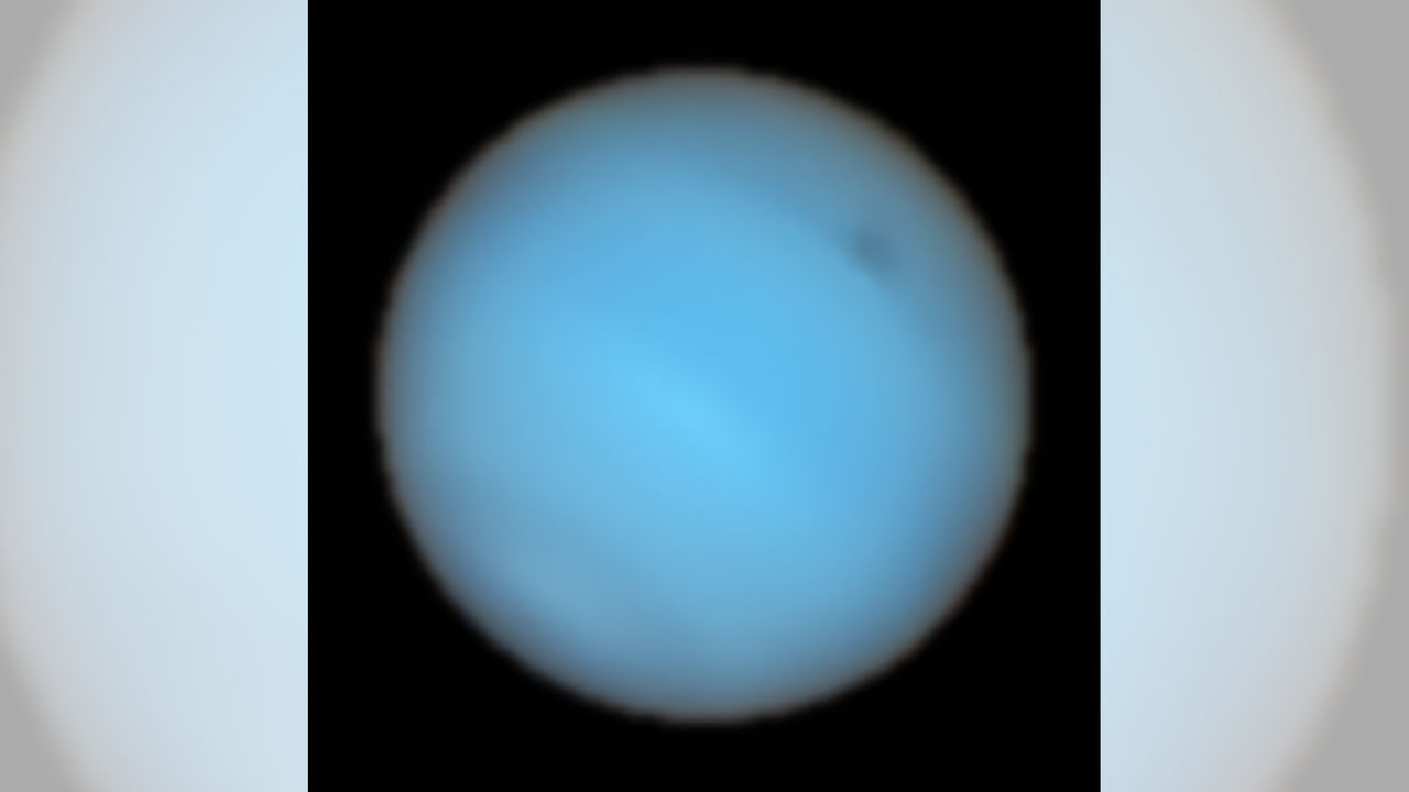 This image shows Neptune observed with the MUSE instrument at ESO&rsquo;s Very Large Telescope. A dark spot can be seen in the upper right.