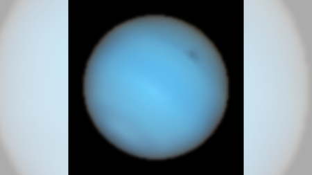 This image shows Neptune observed with the MUSE instrument at ESO’s Very Large Telescope. A dark spot can be seen in the upper right.