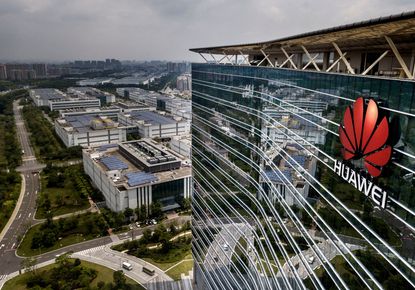 The Huawei logo is seen on the side of the main building at the company's production campus on April 25, 2019 in Dongguan, near Shenzhen, China