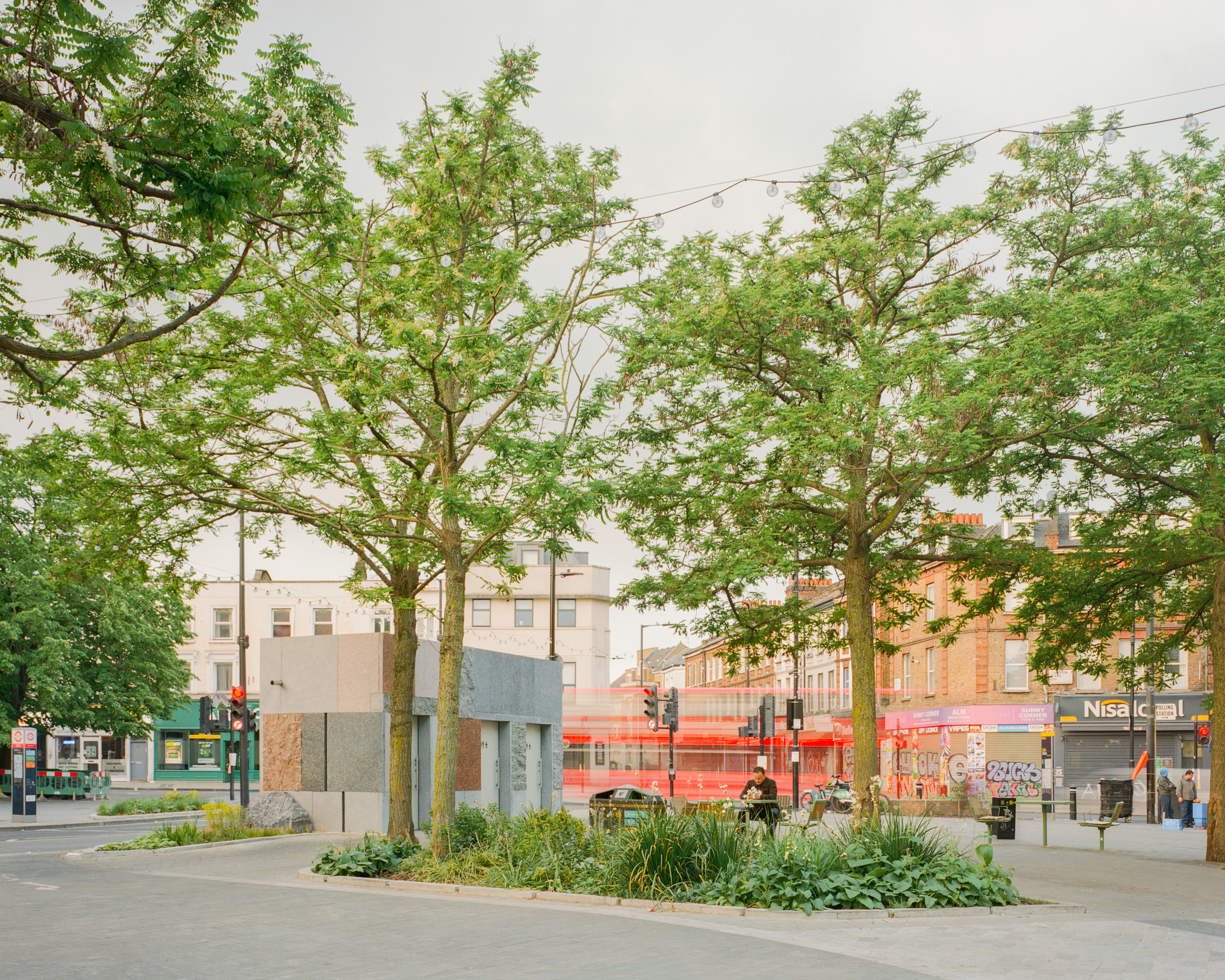 exterior view of Maida Vale public toilet by Studio Weave made out of reclaimed stone, looking like square patchwork